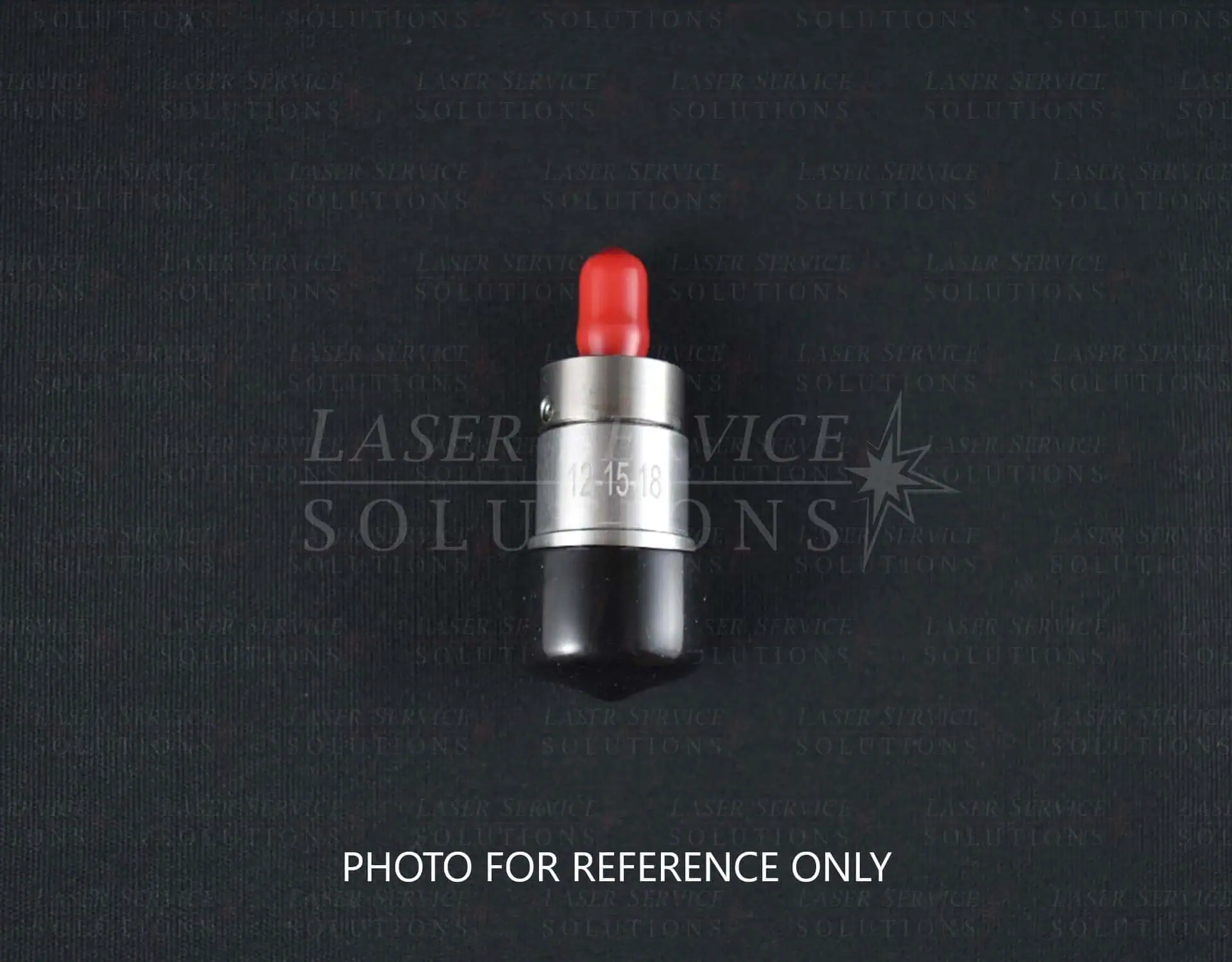 A Candela Gmax Pro Optics Cap Lens Kit, featuring a small cylindrical design with a silver metal band, a black base, and a red tip, displayed against a dark background. “PHOTO FOR REFERENCE ONLY” appears at the bottom.