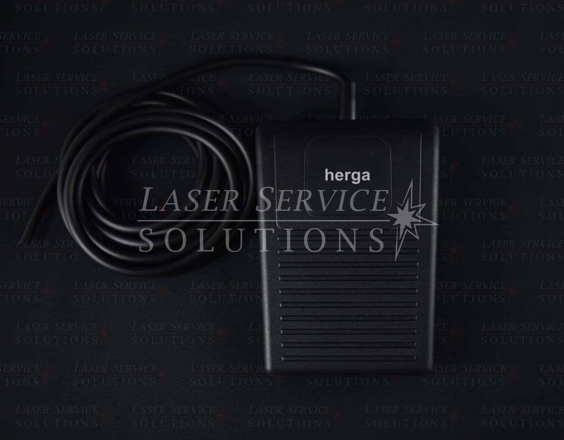 Soprano XL Foot Pedal with a coiled cable, displayed on a dark surface overlaid with the repeated watermark text Laser Service Solutions.