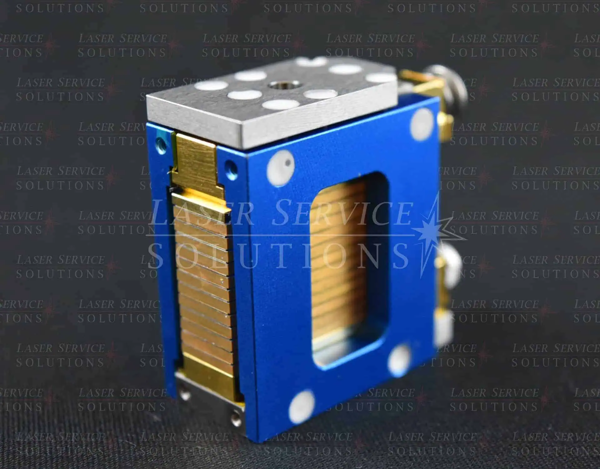 A Soprano “J Style” Diode Stack, featuring a blue and gold rectangular metal design with a window displaying stacked golden plates inside, set against a dark background.