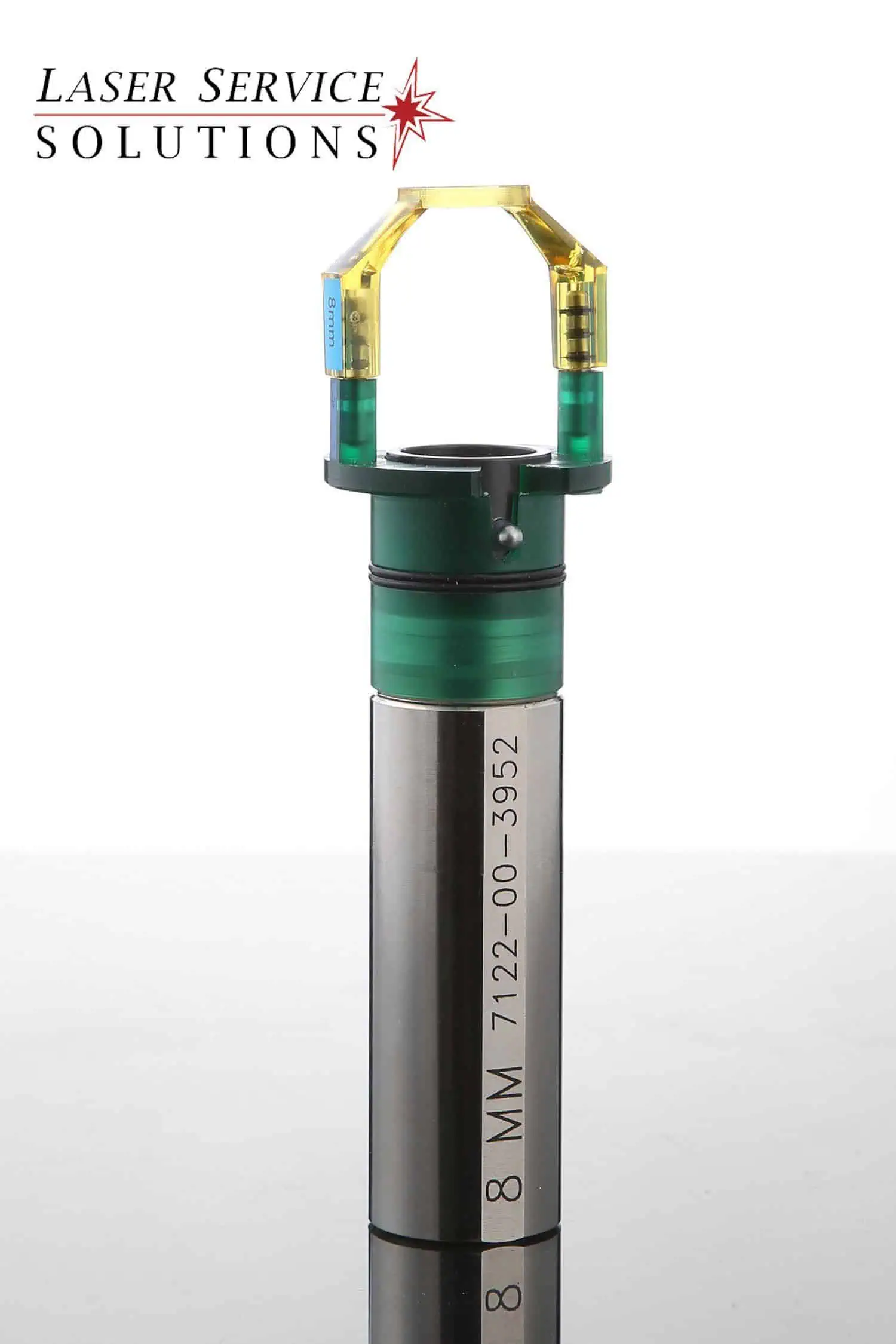 A cylindrical metal and green plastic component from the Candela Gmax Slider Optics Kits, engraved with 8 MM 7122-00-3952 and featuring a yellow attachment on top. The Laser Service Solutions logo appears in the top left corner.