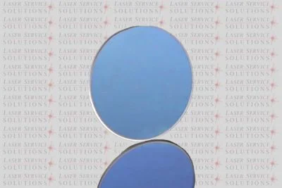 A Candela Vbeam Perfecta Beam Splitter is shown upright with its reflection below, against a background patterned with the words Laser Service Solutions and red laser graphics.