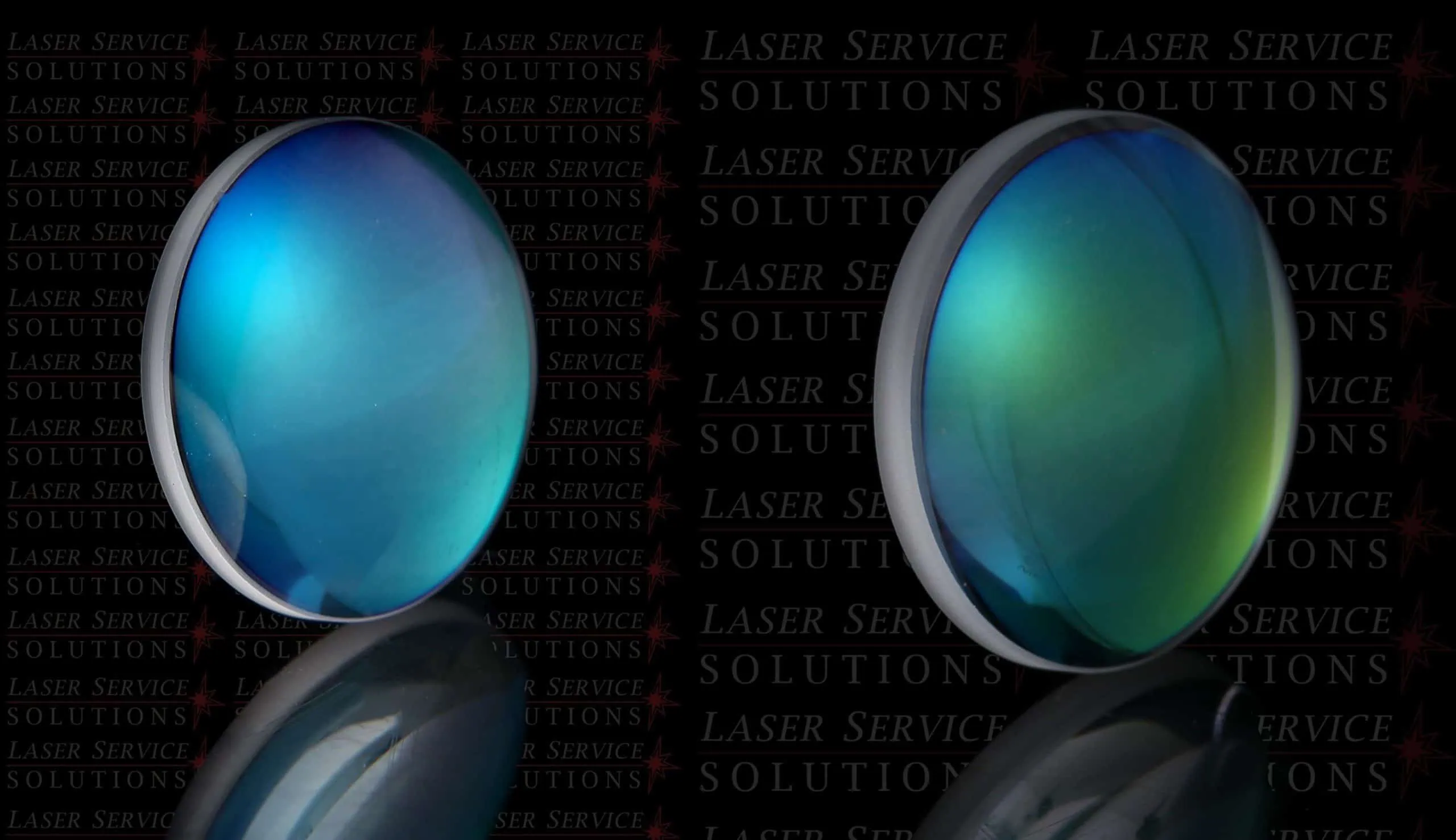 Two circular blue-green optical lenses from the Candela Vbeam Perfecta Fiber Focusing Lens Kit reflecting light, positioned side by side on a reflective surface, with a background displaying the repeated text LASER SERVICE SOLUTIONS in a dark pattern.