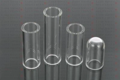 Four Elite Dust Tubes—three open-ended and one closed with a rounded tip—stand upright on a reflective surface. The background features the repeated text “LASER SERVICE SOLUTIONS” in gray and red.