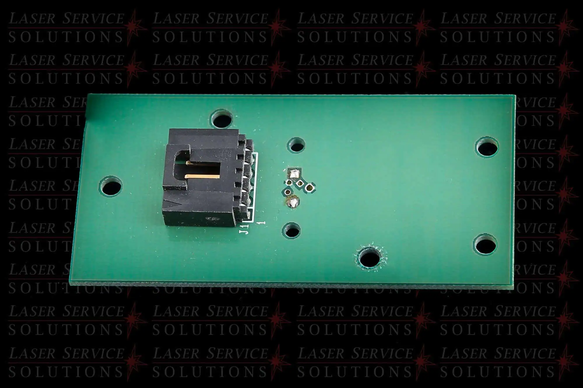 Candela MGY Head Detector PCB—a green rectangular circuit board featuring a black connector and four large mounting holes, displayed on a background patterned with the red and gray text “Laser Service Solutions.”.