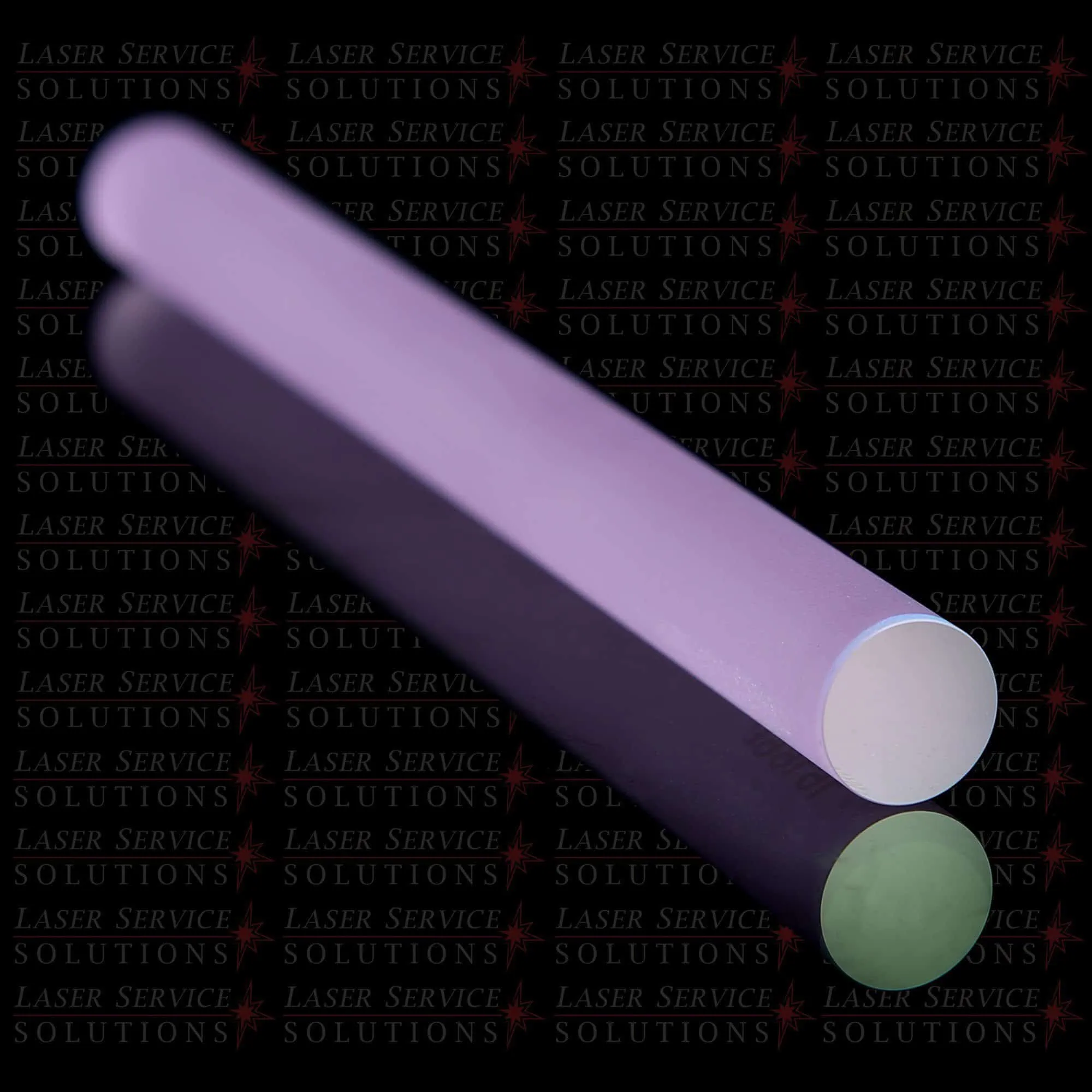 A cylindrical, purple Candela Yag Laser Crystal Rod with reflective surfaces lies on a glossy black surface. The background features repeated, diagonally-patterned text: LASER SERVICE SOLUTIONS.