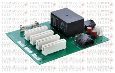 Elite Input Voltage Selection Board featuring a green circuit board with white terminal blocks, a large black relay, two red cylindrical capacitors, and additional electronic components, photographed on a white background with a faint Laser Service Solutions watermark.