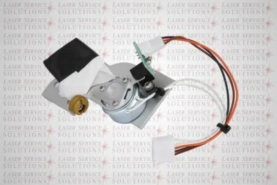 A close-up of the Elite Resonator Shutter Assembly, featuring its wires and connectors, positioned on a background repeatedly printed with “Laser Service Solutions” in gray and red text.