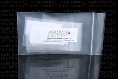 A clear plastic bag labeled Elite Handpiece Optics Kit with contact details, set against a background with repeated Laser Service Solutions branding.