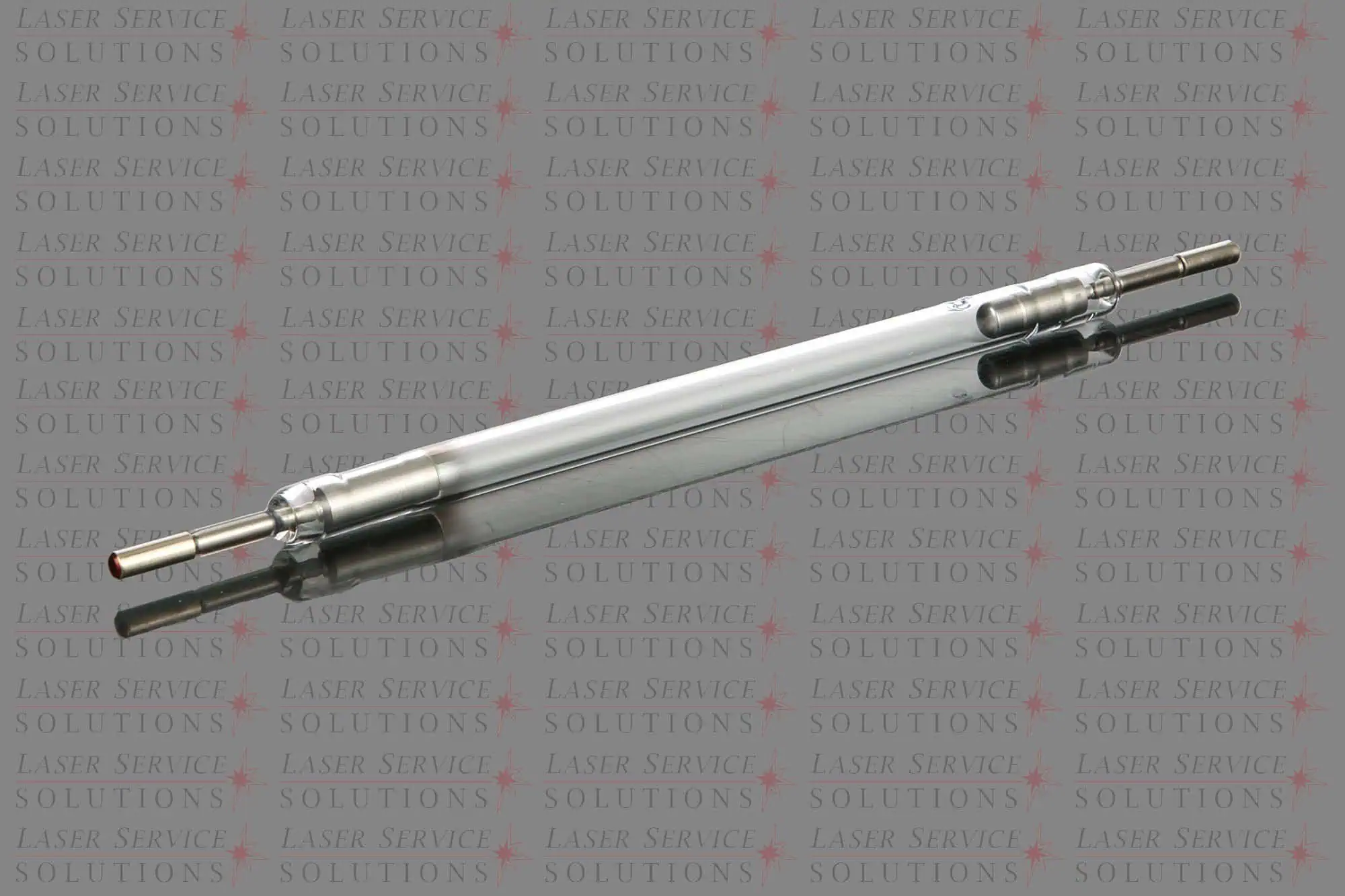 A set of HOYA ConBio Flashlamps with cylindrical glass bodies and metallic ends is shown resting on a reflective surface, positioned against a background featuring the repeated Laser Service Solutions text.