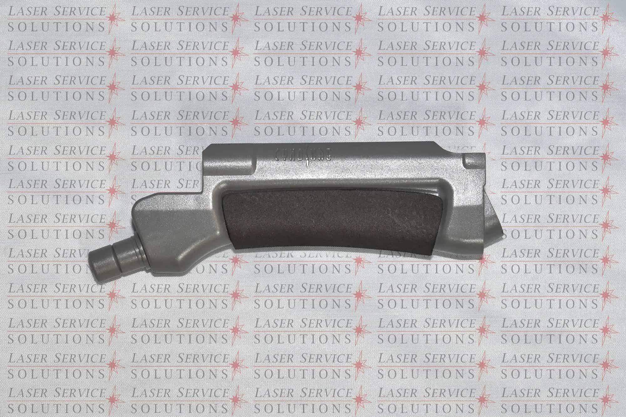 A metallic industrial part with a black grip is displayed on a background patterned with the words LASER SERVICE SOLUTIONS in red and grey.